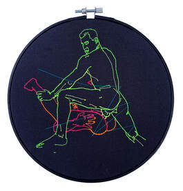 Neon embroidery on black cotton. Displayed in a black embroidery hoop. Human male forms kissing.